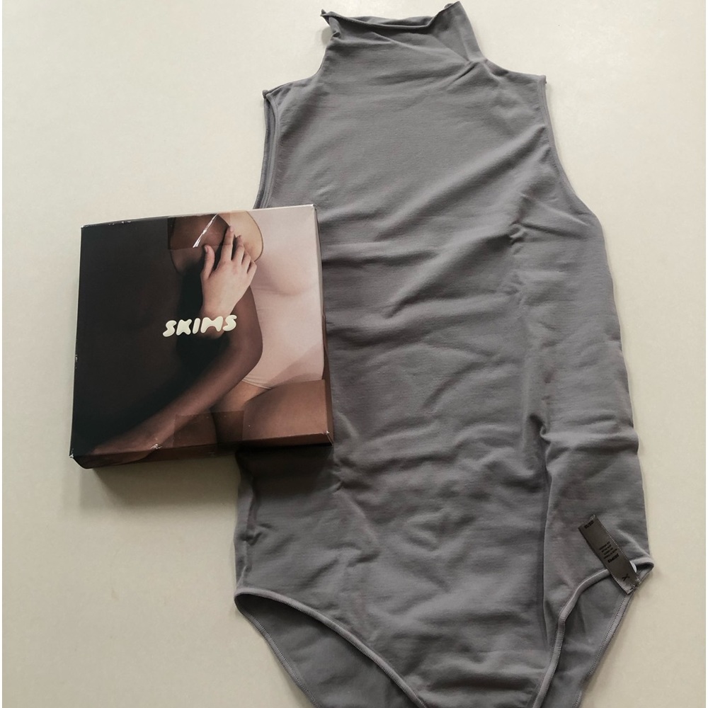 Skims mock neck sleeveless bodysuit.